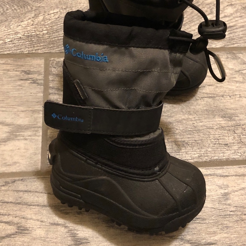 Like new waterproof snow boots with reflective Columbia on the backs. Worn once